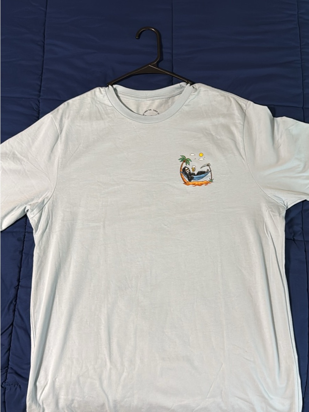 Large Last Call Light Blue Short-Sleeve Graphic Tee with Beach Motif